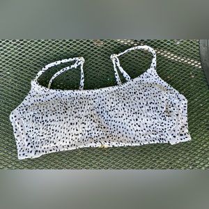 Juniors cream and black polka dot smocked bralette bikini top.